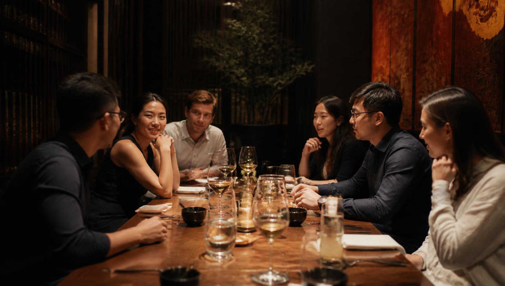 Vietnamese and international founders in conversation over dinner.